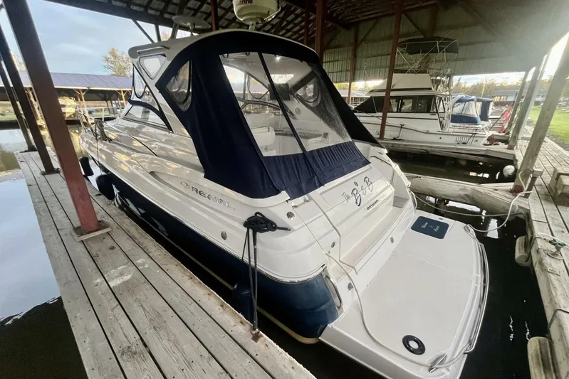  Yacht Photos Pics 2008 Regal Commodore 3760 IO boat docked under a covered marina.