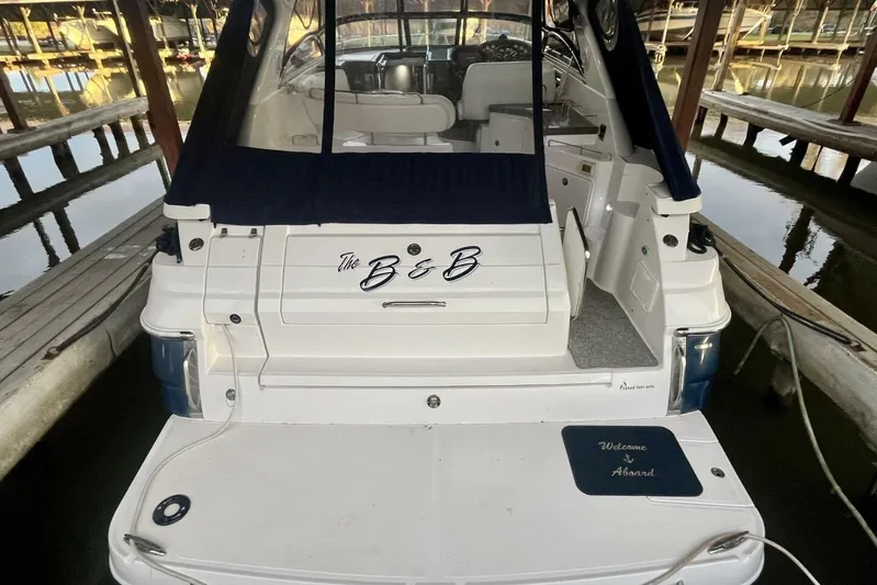  Yacht Photos Pics 2008 Regal Commodore 3760 IO boat docked, rear view with "Welcome Aboard" mat.