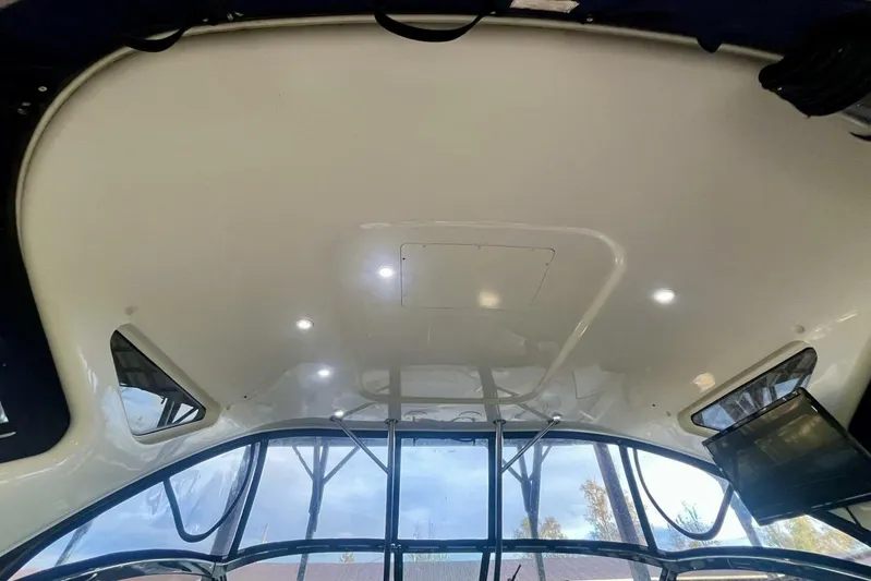  Yacht Photos Pics Interior view of 2008 Regal Commodore 3760 IO boat ceiling with windows and lighting.