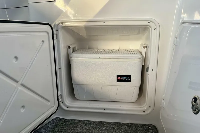 Yacht Photos Pics Open storage compartment with a marine cooler inside a 2008 Regal Commodore 3760 IO boat.