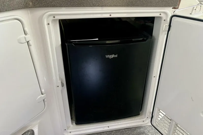  Yacht Photos Pics Compact black Whirlpool fridge in 2008 Regal Commodore 3760 IO boat.