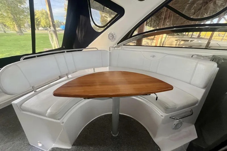  Yacht Photos Pics 2008 Regal Commodore 3760 IO interior with white seating and wooden table.