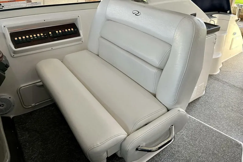  Yacht Photos Pics 2008 Regal Commodore 3760 IO boat interior with white leather seating and control panel.