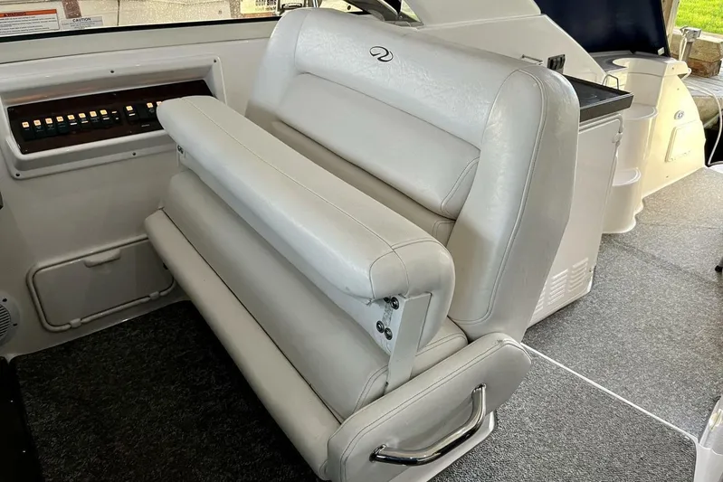  Yacht Photos Pics 2008 Regal Commodore 3760 IO boat interior with white leather seating and control panel.
