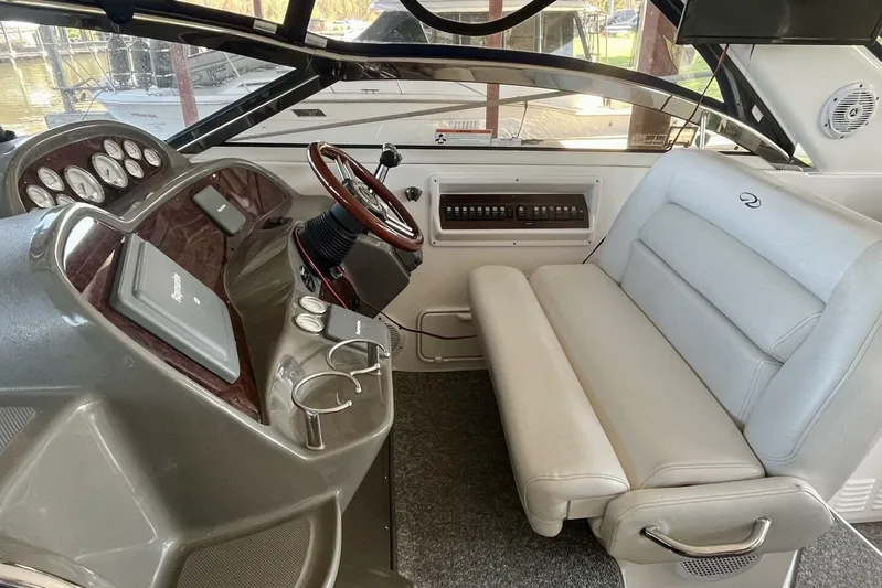  Yacht Photos Pics 2008 Regal Commodore 3760 IO boat interior with steering wheel and seating area.