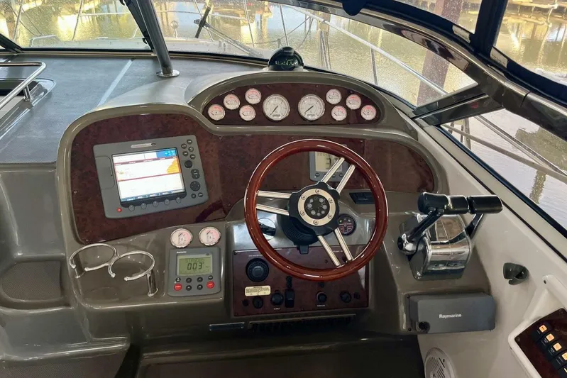  Yacht Photos Pics 2008 Regal Commodore 3760 IO boat dashboard with steering wheel, gauges, and navigation system.
