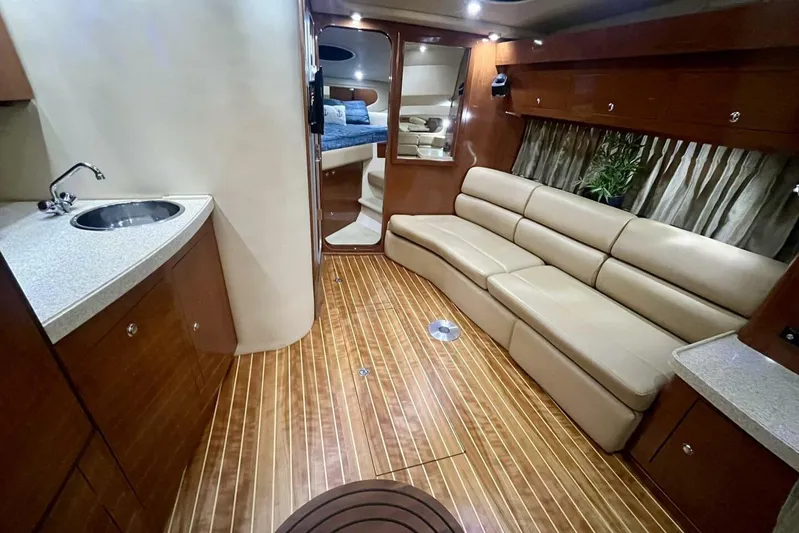  Yacht Photos Pics Luxurious interior of 2008 Regal Commodore 3760 IO yacht with leather seating and kitchenette.