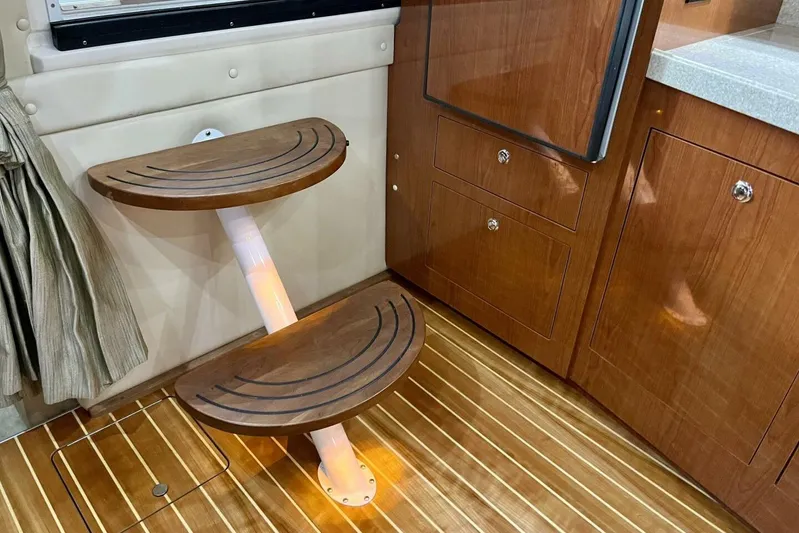  Yacht Photos Pics 2008 Regal Commodore 3760 IO interior with wooden steps and cabinetry.