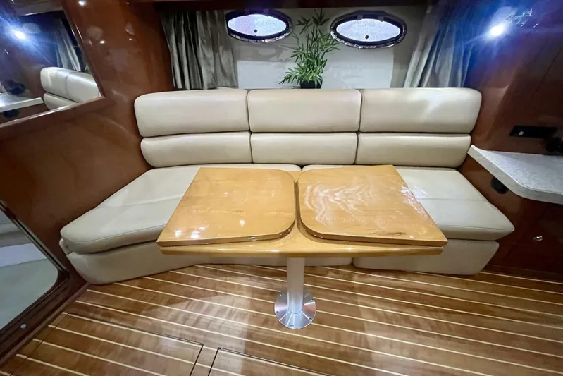  Yacht Photos Pics Luxurious interior of 2008 Regal Commodore 3760 IO with beige seating and wooden table.