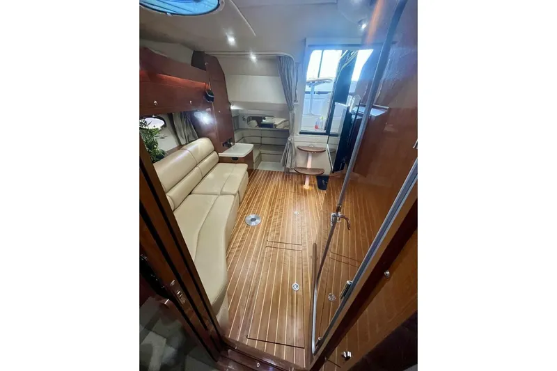  Yacht Photos Pics 2008 Regal Commodore 3760 IO interior with beige seating and wooden flooring.