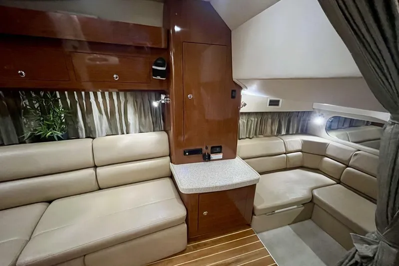  Yacht Photos Pics Luxurious interior of 2008 Regal Commodore 3760 IO yacht with beige seating and wood accents.