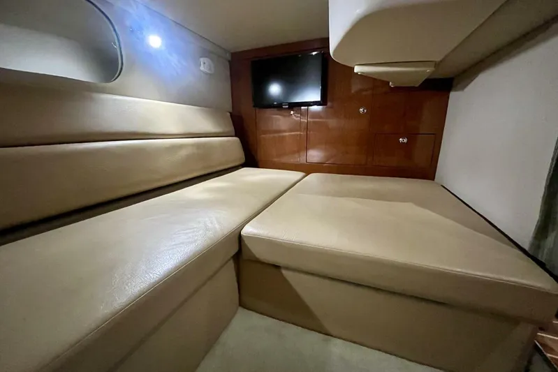  Yacht Photos Pics 2008 Regal Commodore 3760 IO cabin interior with beige seating and wall-mounted TV.