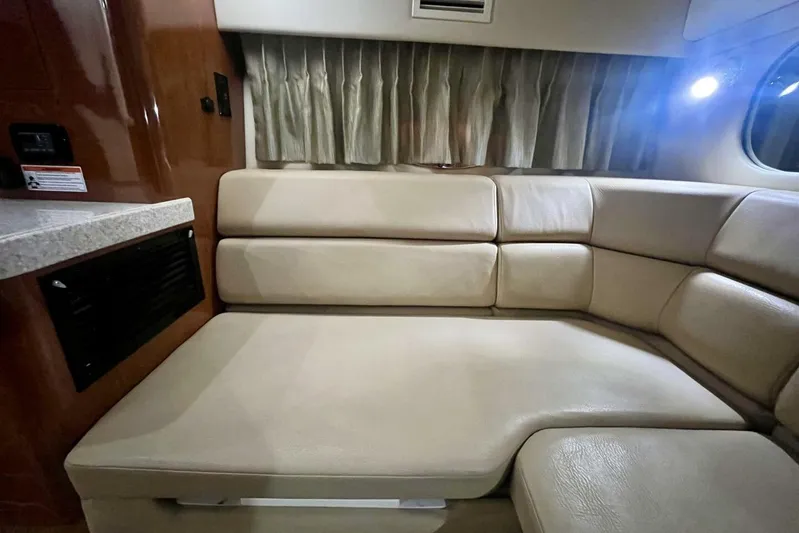  Yacht Photos Pics Interior of 2008 Regal Commodore 3760 IO with beige leather seating and curtains.