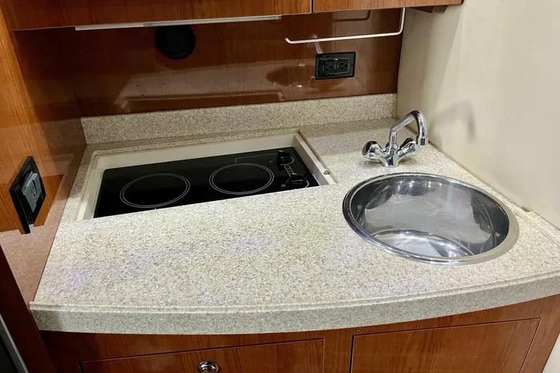  Yacht Photos Pics 2008 Regal Commodore 3760 IO yacht kitchen with stove and sink.