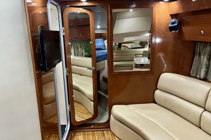  Yacht Photos Pics Luxurious interior of 2008 Regal Commodore 3760 IO yacht with leather seating and wood finishes.