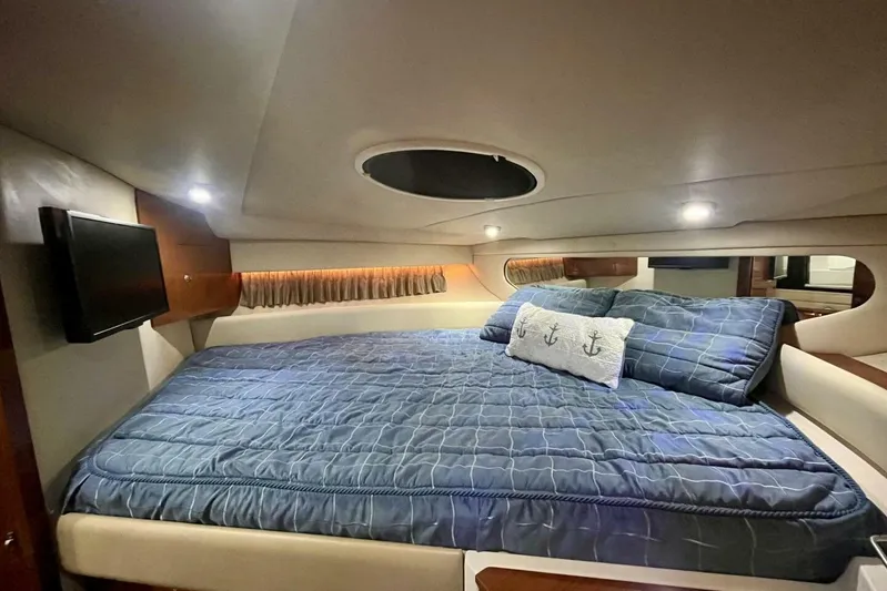  Yacht Photos Pics Luxurious cabin interior of 2008 Regal Commodore 3760 IO with cozy bedding and ambient lighting.
