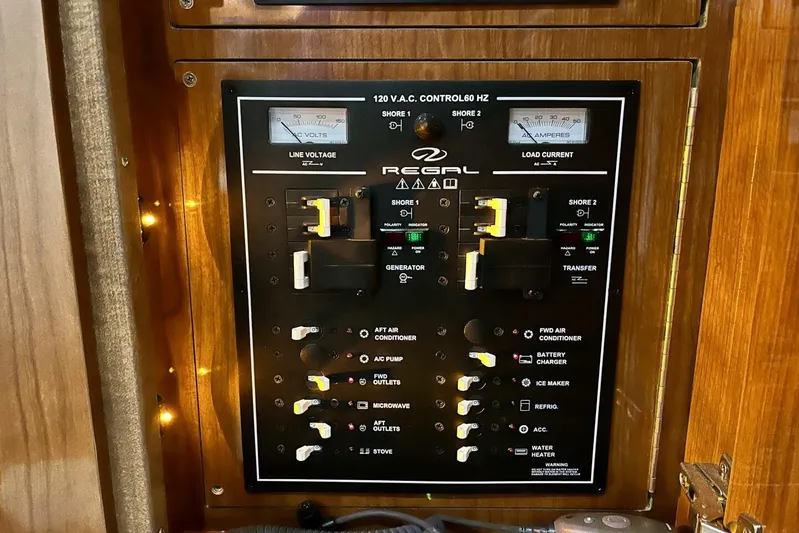  Yacht Photos Pics Control panel of a 2008 Regal Commodore 3760 IO boat, featuring voltage and current meters.