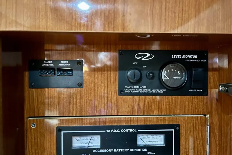  Yacht Photos Pics Control panel of a 2008 Regal Commodore 3760 IO boat, featuring antenna and water level monitors.