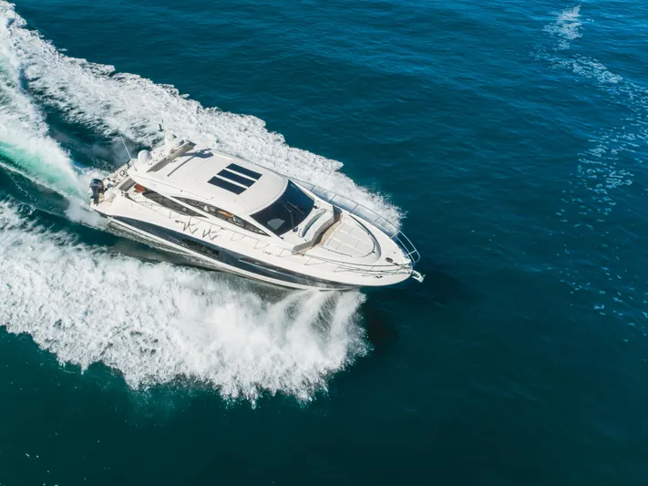 No Regrets Yacht Photos Pics 2016 Sea Ray L590 yacht cruising on open blue water.