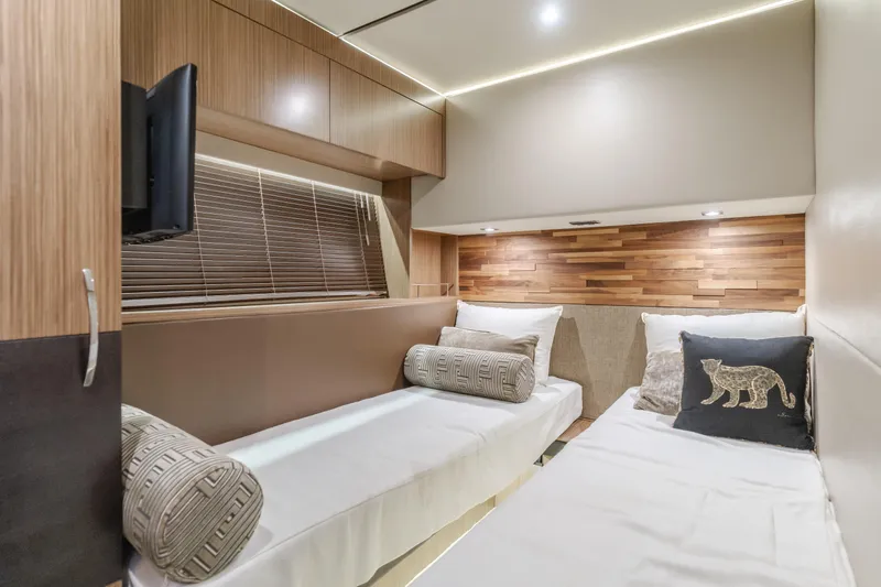 No Regrets Yacht Photos Pics Luxurious cabin interior of 2016 Sea Ray L590 yacht with twin beds and modern decor.