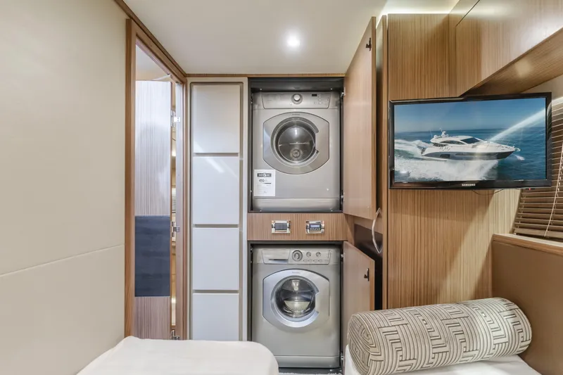 No Regrets Yacht Photos Pics 2016 Sea Ray L590 yacht interior with washer, dryer, and TV.