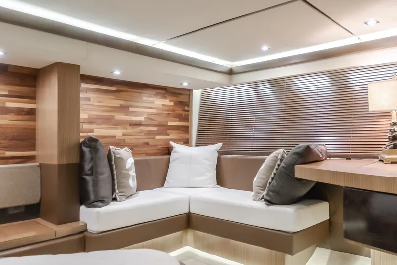 No Regrets Yacht Photos Pics Luxurious interior of 2016 Sea Ray L590 yacht with modern seating and elegant wood accents.