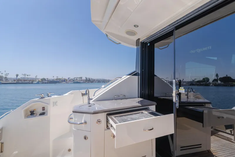 No Regrets Yacht Photos Pics Outdoor kitchen on 2016 Sea Ray L590 yacht with ocean view.