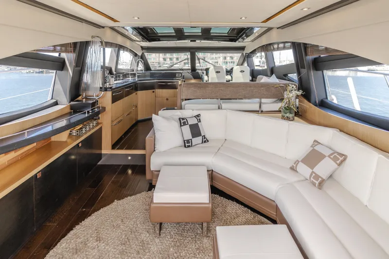 No Regrets Yacht Photos Pics Luxurious interior of 2016 Sea Ray L590 yacht with elegant seating and panoramic windows.