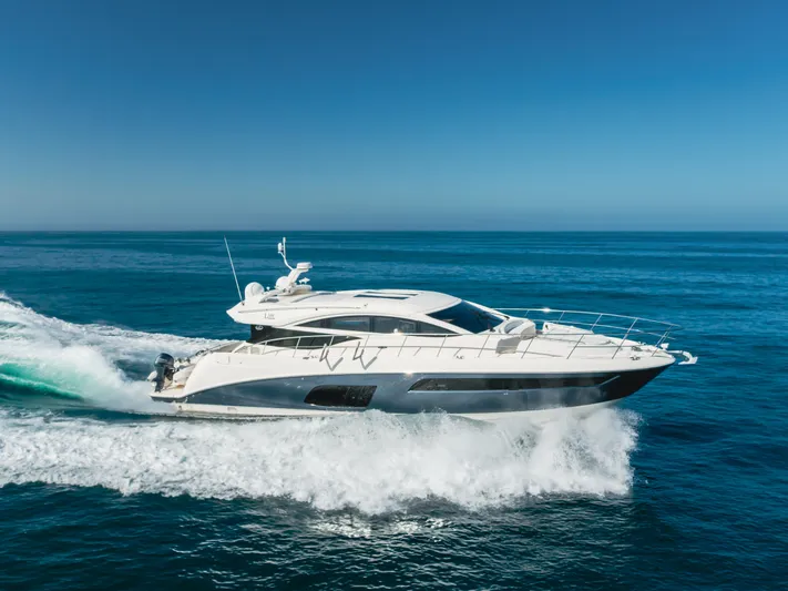 No Regrets Yacht Photos Pics 2016 Sea Ray L590 yacht cruising on open ocean under clear blue sky.