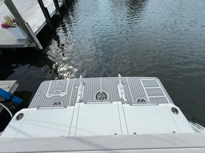  Yacht Photos Pics 2018 Cruisers Yachts 42 Cantius swim platform by the water.