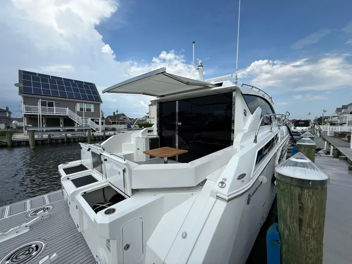  Yacht Photos Pics 2018 Cruisers Yachts 42 Cantius docked, featuring sleek design and spacious deck area.