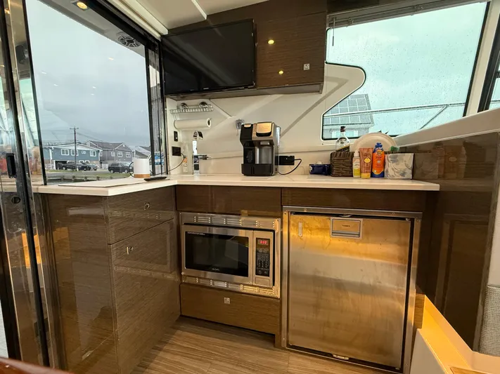  Yacht Photos Pics Luxurious 2018 Cruisers Yachts 42 Cantius galley with modern appliances and sleek design.