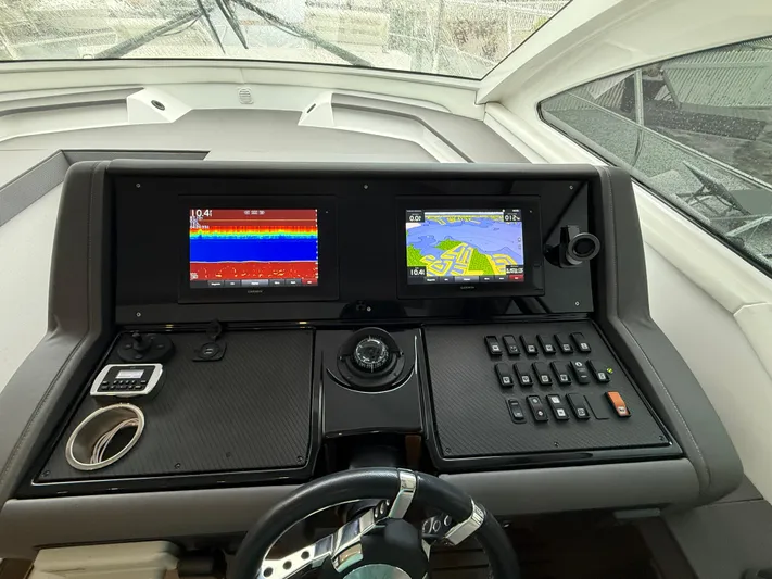  Yacht Photos Pics Helm of 2018 Cruisers Yachts 42 Cantius with navigation displays and controls.