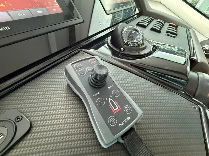  Yacht Photos Pics Control panel of 2018 Cruisers Yachts 42 Cantius with joystick and compass.