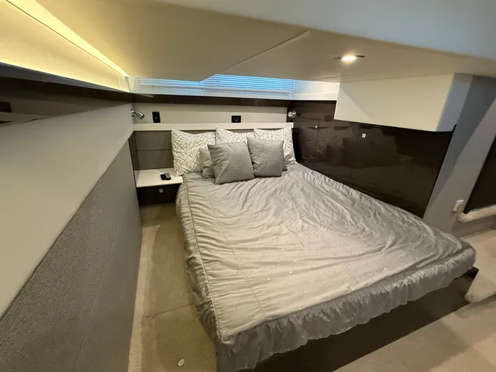  Yacht Photos Pics Luxurious bedroom interior of 2018 Cruisers Yachts 42 Cantius with modern design and cozy bedding.
