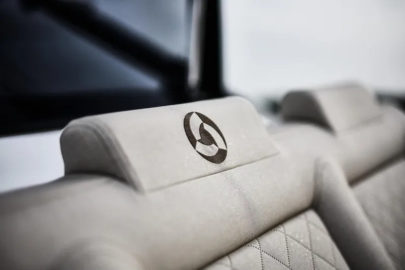  Yacht Photos Pics 2024 Skamander Sorrento interior with embroidered logo on beige headrest.