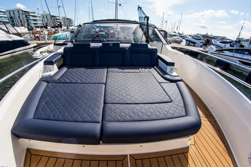  Yacht Photos Pics 2024 Skamander Sorrento yacht with spacious sunbathing deck, docked at marina.