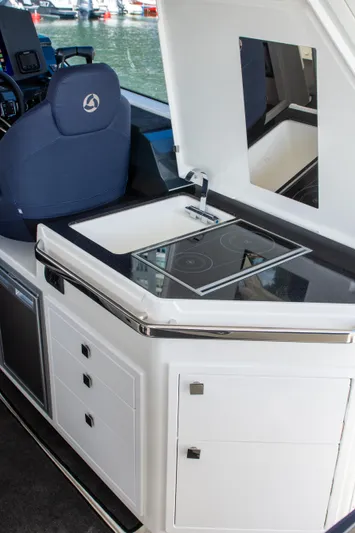  Yacht Photos Pics 2024 Skamander Sorrento yacht interior with modern kitchenette and sleek design.