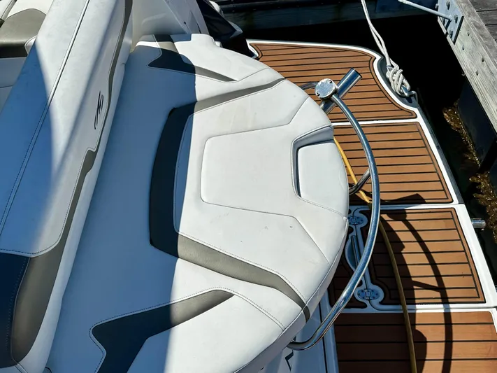 Magic Ten Yacht Photos Pics 2015 Monterey 335 Sport Yacht, white seating, teak deck, docked.