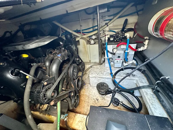 Magic Ten Yacht Photos Pics Engine room of a 2015 Monterey 335 Sport Yacht, showcasing mechanical components and wiring.