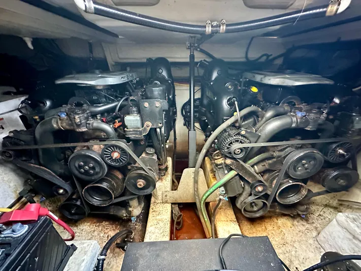 Magic Ten Yacht Photos Pics Engine compartment of a 2015 Monterey 335 Sport Yacht, showcasing dual engines and mechanical components.