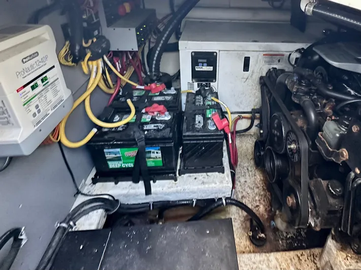 Magic Ten Yacht Photos Pics Engine room of a 2015 Monterey 335 Sport Yacht with batteries and wiring.