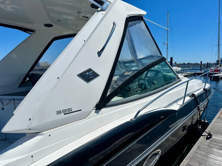 Magic Ten Yacht Photos Pics 2015 Monterey 335 Sport Yacht docked at marina under clear blue sky.