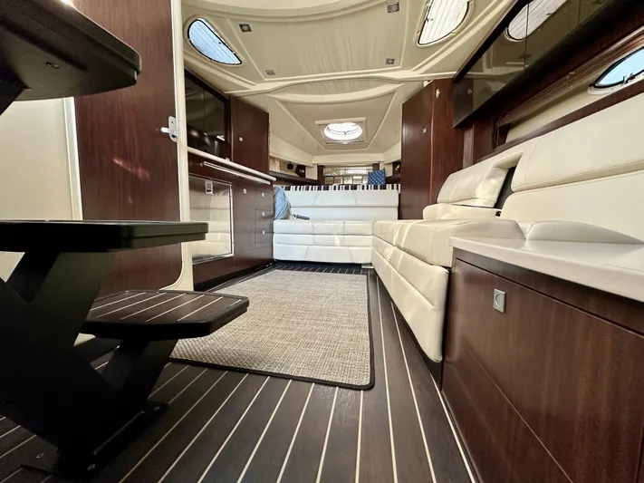 Magic Ten Yacht Photos Pics Luxurious interior of a 2015 Monterey 335 Sport Yacht with elegant seating and modern design.