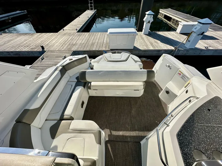 Magic Ten Yacht Photos Pics 2015 Monterey 335 Sport Yacht interior with seating, docked at marina.