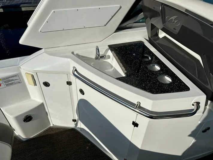 Magic Ten Yacht Photos Pics 2015 Monterey 335 Sport Yacht kitchenette with sink and countertop.