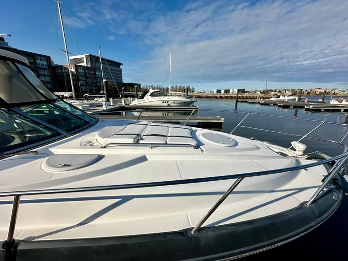 Magic Ten Yacht Photos Pics 2015 Monterey 335 Sport Yacht docked at a marina under a clear blue sky.