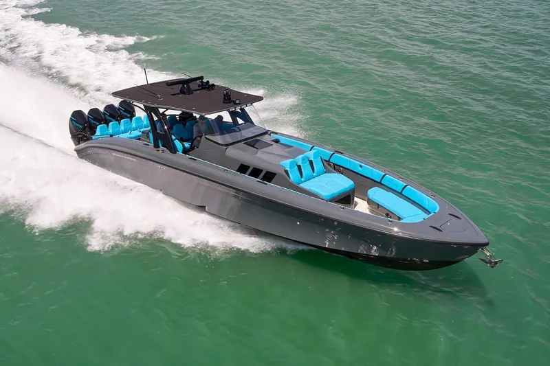  Yacht Photos Pics 2022 Midnight Express 43' Solstice speedboat cruising on turquoise water.