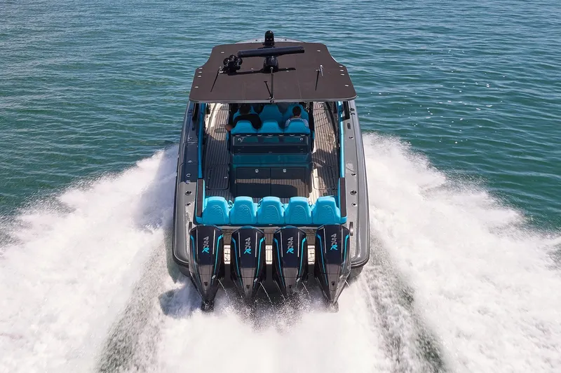  Yacht Photos Pics 2022 Midnight Express 43' Solstice boat cruising on open water, rear view.