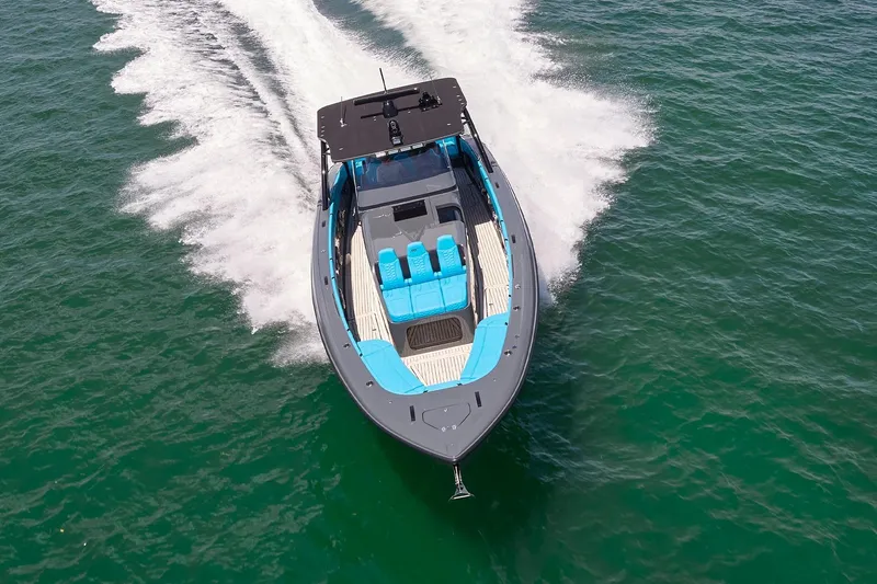  Yacht Photos Pics 2022 Midnight Express 43' Solstice boat cruising on open water, aerial view.